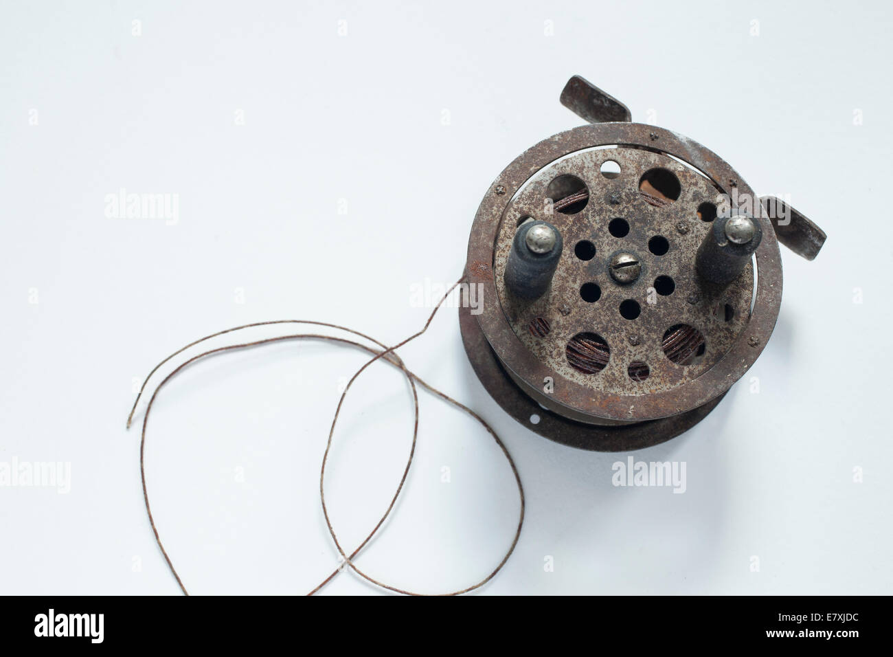 Antique fly fishing reel with line. Stock Photo