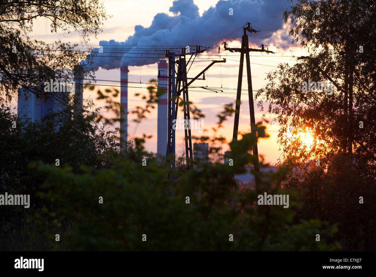 Energy. Smoke from chimney of power plant or station at the sunset ...