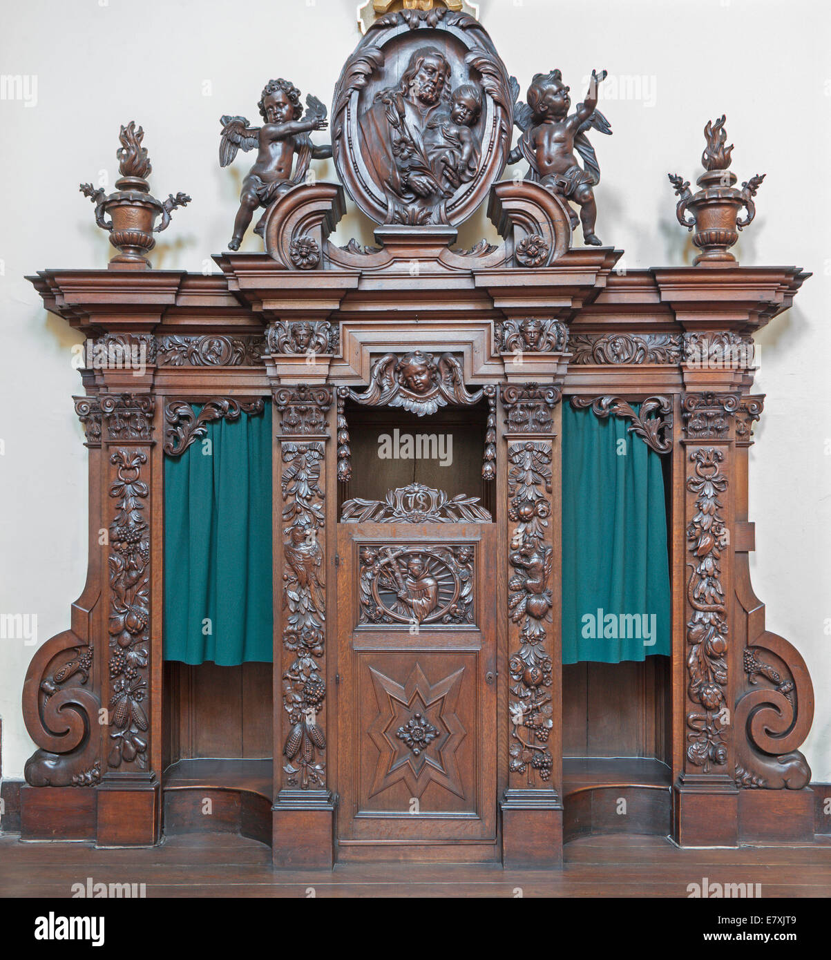 BRUGES, BELGIUM - JUNE 13, 2014: The carved confession box in Karmelietenkerk (Carmelites church) Stock Photo