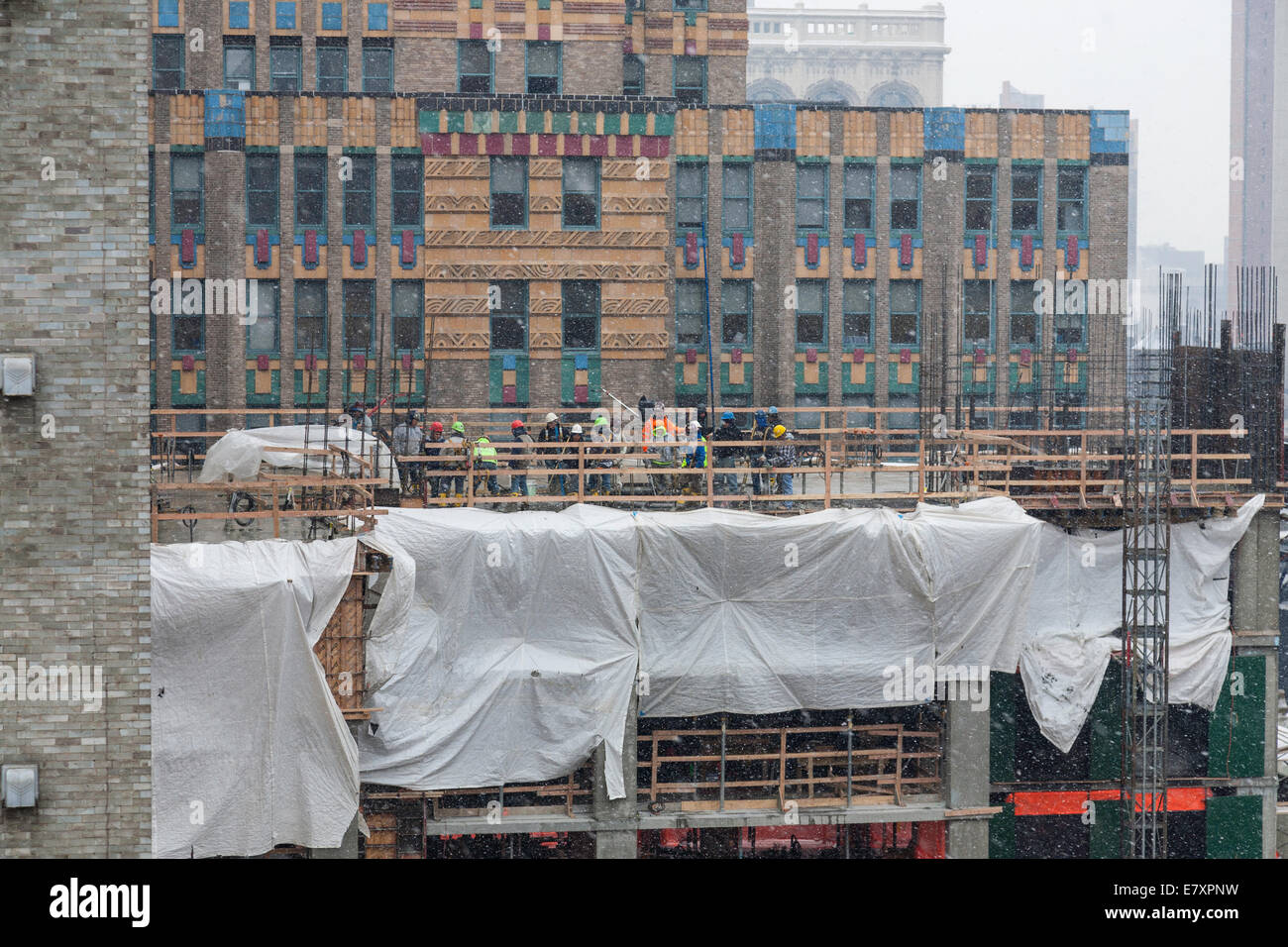 High-rise Building Construction Site with tradesmen, NYC, USA Stock Photo