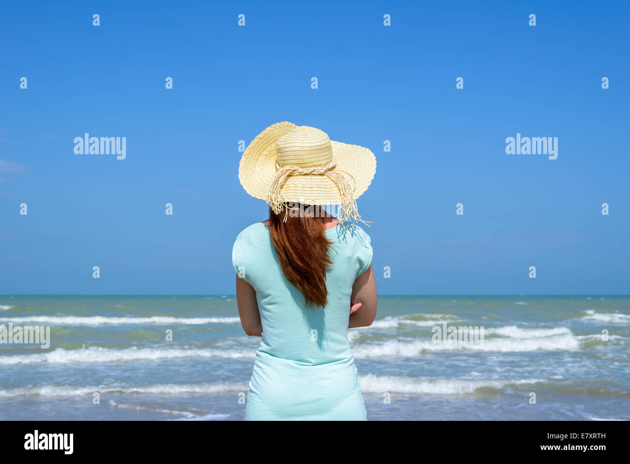 Long hair girl looking at the sea Stock Photo - Alamy