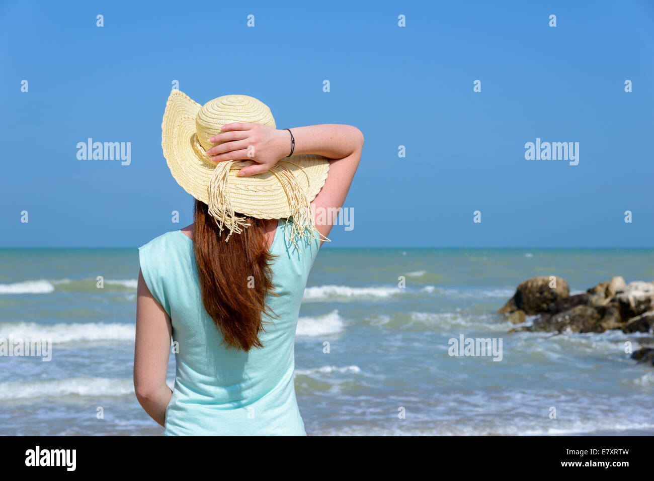 Long hair girl looking at the sea Stock Photo - Alamy