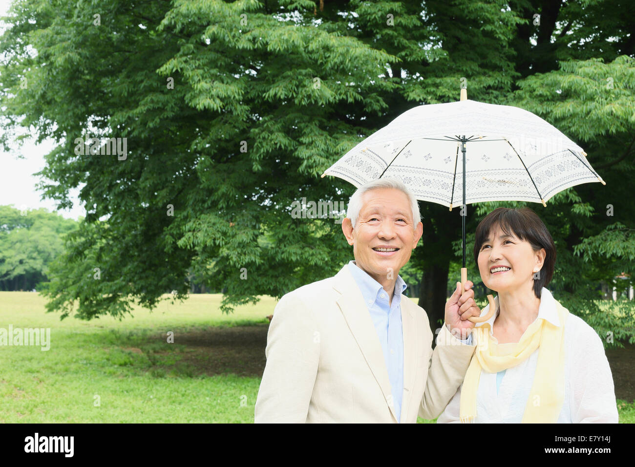Senior adult Japanese couple in a park Stock Photo - Alamy