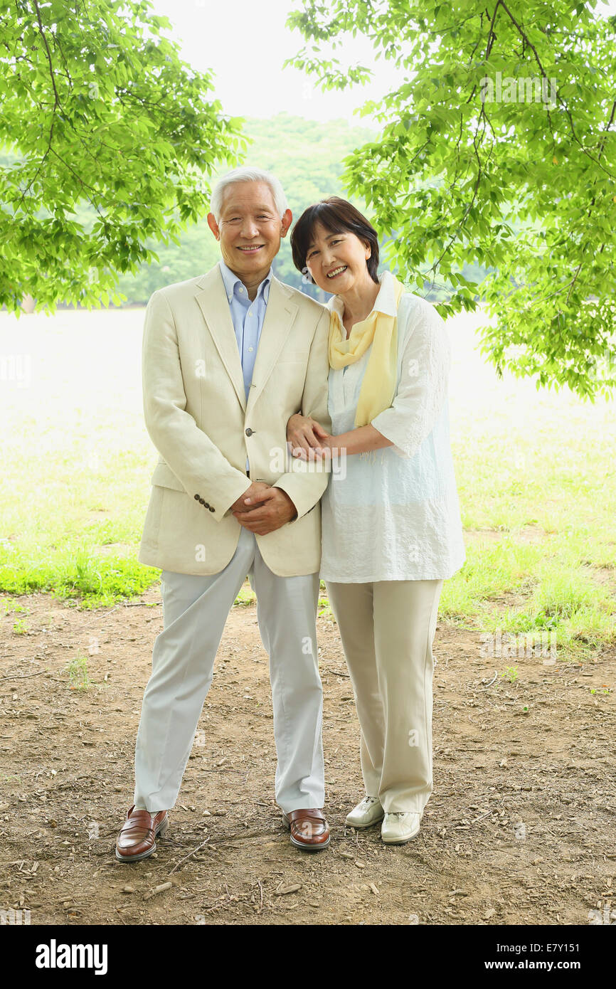 Senior adult Japanese couple in a park Stock Photo - Alamy
