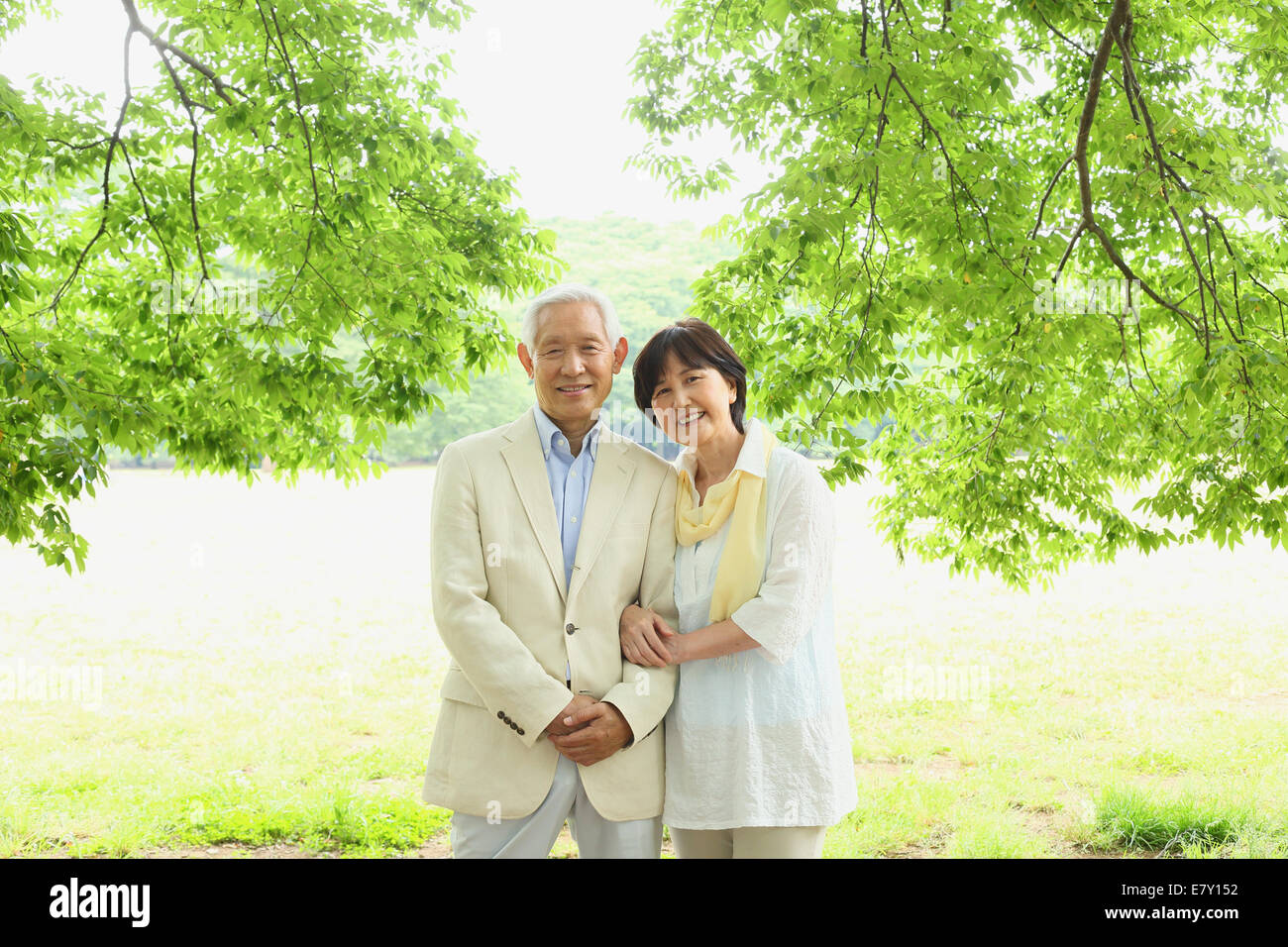 Senior adult Japanese couple in a park Stock Photo - Alamy