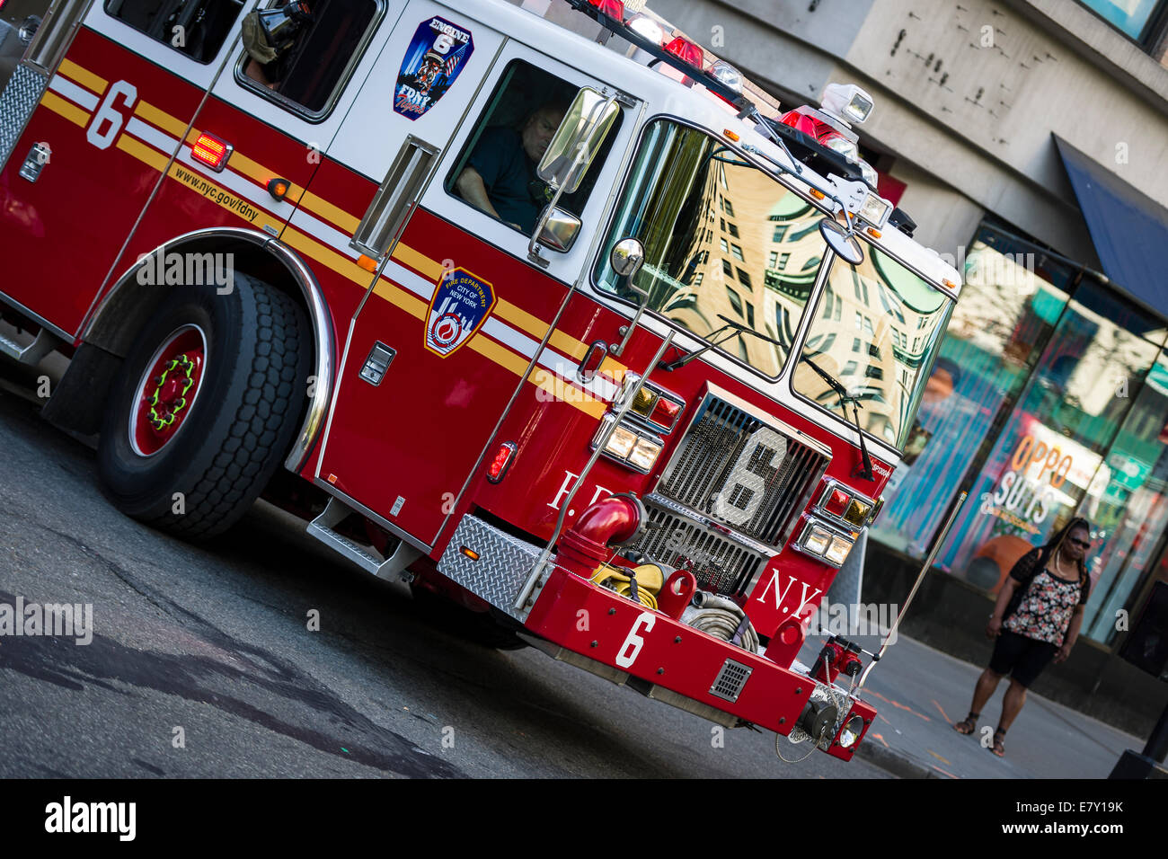 A New York Fire Department Engine answering an emergency call in Midtown New York. Stock Photo
