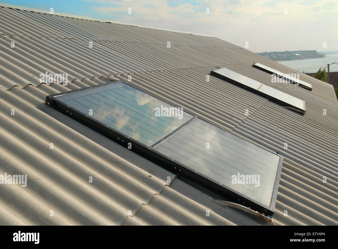 Solar water heating system on the house roof Stock Photo - Alamy