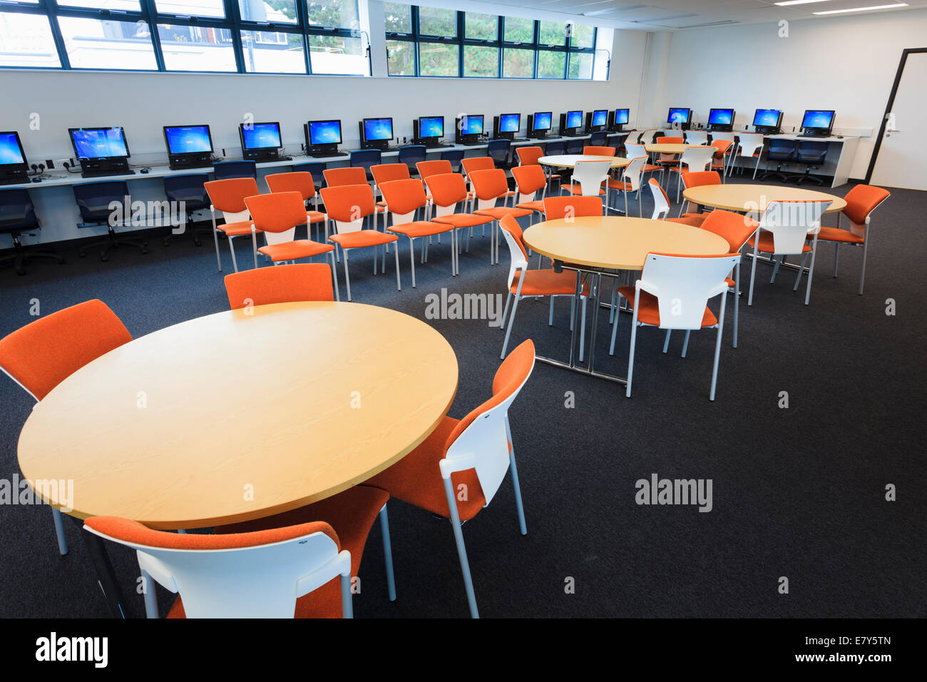 Unoccupied library with computers around the walls at Teddington Sixth Form College. Stock Photo