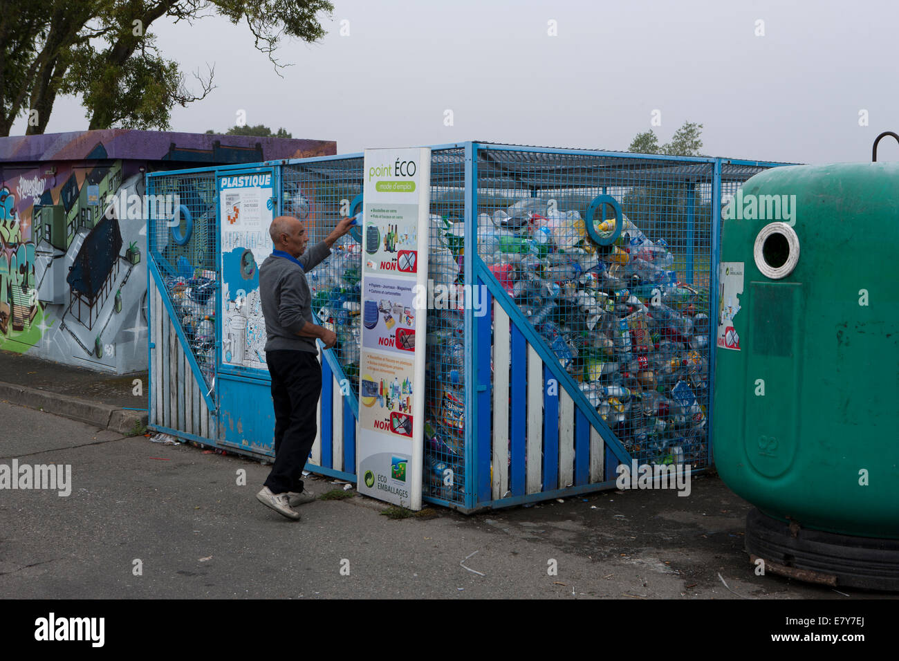 Recycling containers in a Car Park in the town of Plouescat, Brittany, France Stock Photo