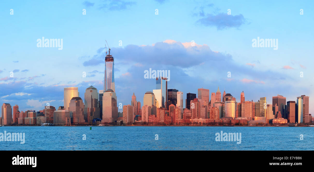 Downtown Manhattan skyline at sunset over Hudson River in New York City ...