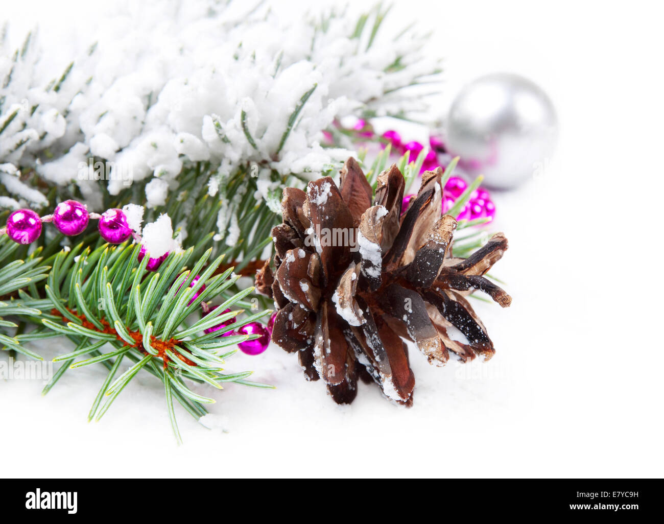 Christmas background with pine cone, bead and fir branch Stock Photo ...
