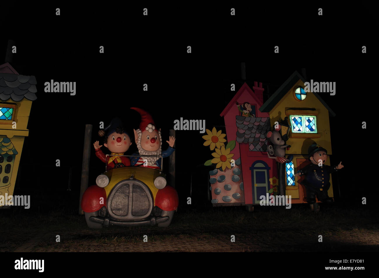 Night view Noddy Tableau, with Noddy and Big Ears sitting car, and PC Plod standing front house, Blackpool Illuminations, UK Stock Photo