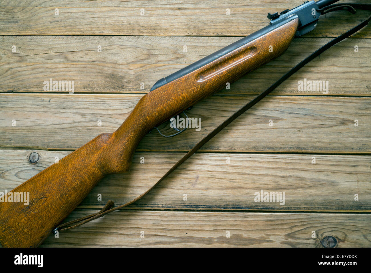 rifle on a wooden background Stock Photo