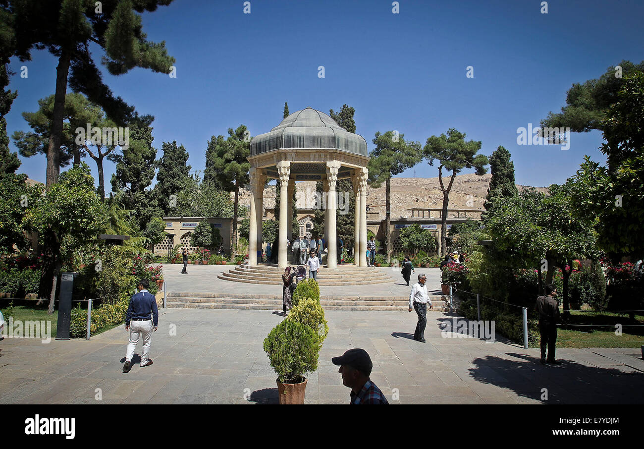 Shiraz. 26th Sep, 2014. People read poems of Hafez as they sit around the tomb of Persian mystic poet Hafez in southern city of Shiraz on Sept. 26, 2014. Hafez collected poems are regarded as a pinnacle of Persian literature and are to be found in the homes of most people in Iran and Afghanistan. © Ahmad Halabisaz/Xinhua/Alamy Live News Stock Photo