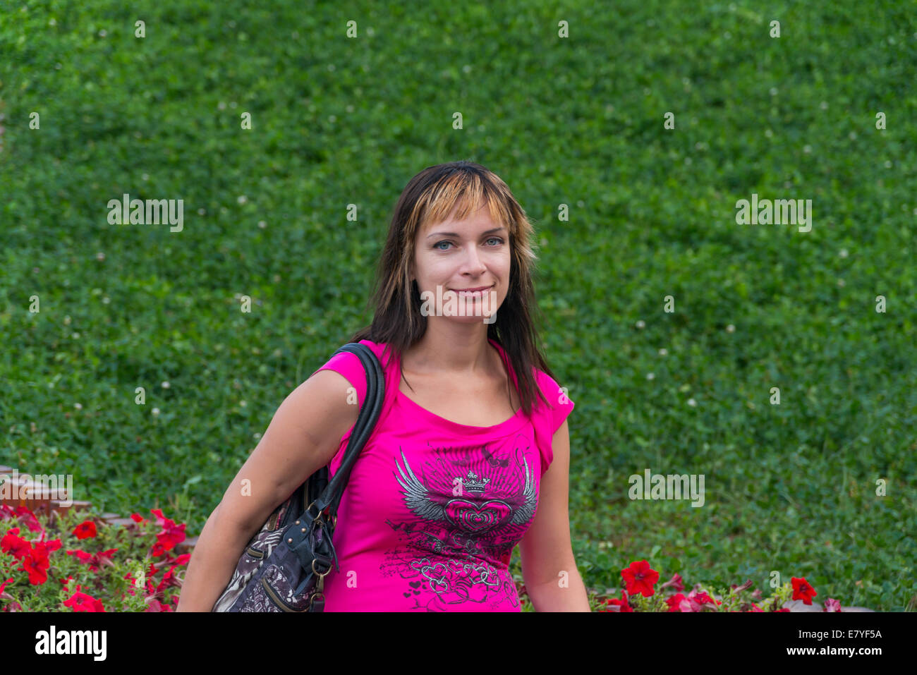 Nice girl smiling to me in a park Stock Photo