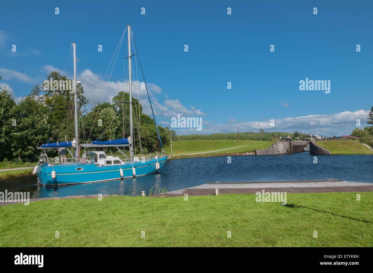 Yacht going along CrinanCanal at Dunardry Locks Argyll & Bute Scotland Stock Photo