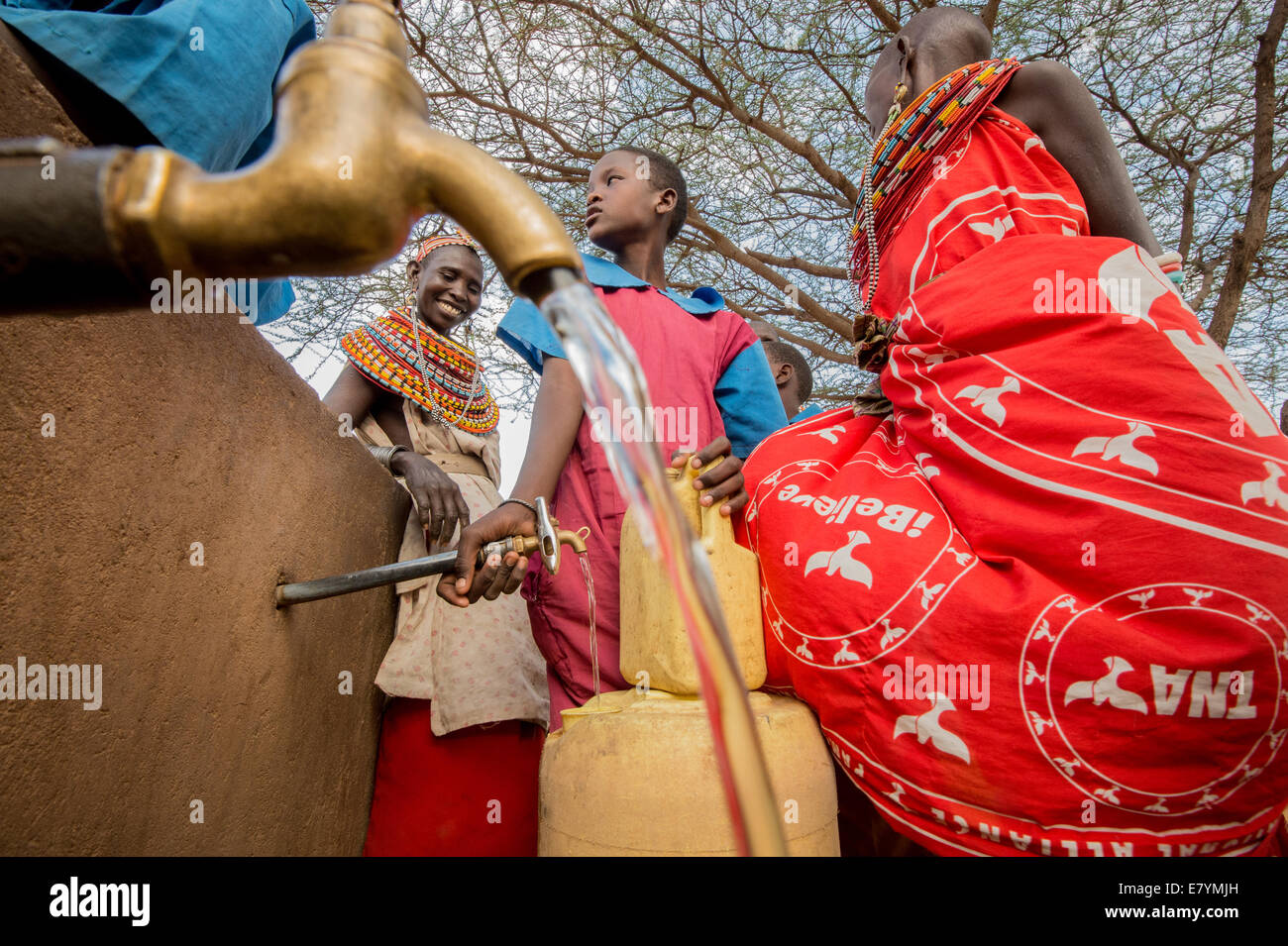 Women collect water from a well built by Northern Rangelands Trust and the Nature conservancy at the West Gate Conservancy in No Stock Photo