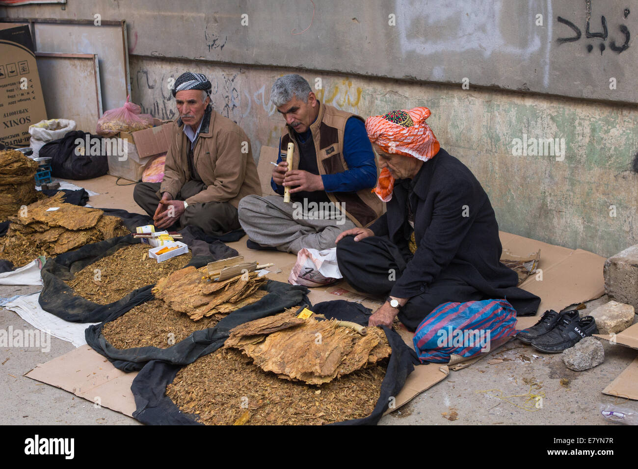Kurdish street vendors wearing traditional clothing selling tobacco in Erbil (Arbil), Iraqi Kurdistan province, Iraq. Stock Photo