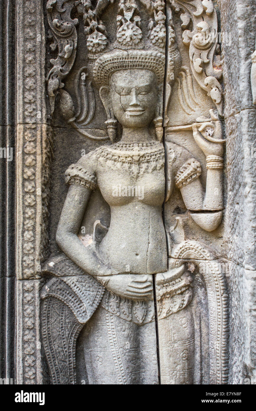 Sculpture of a Hindu goddess on a wall at the ancient Hindu temple complex of Angkor Wat, near