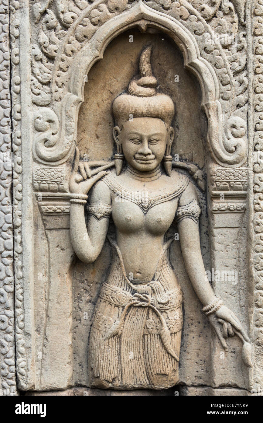 Sculpture of a Hindu goddess on a wall at the ancient Hindu temple complex of Angkor Wat, near