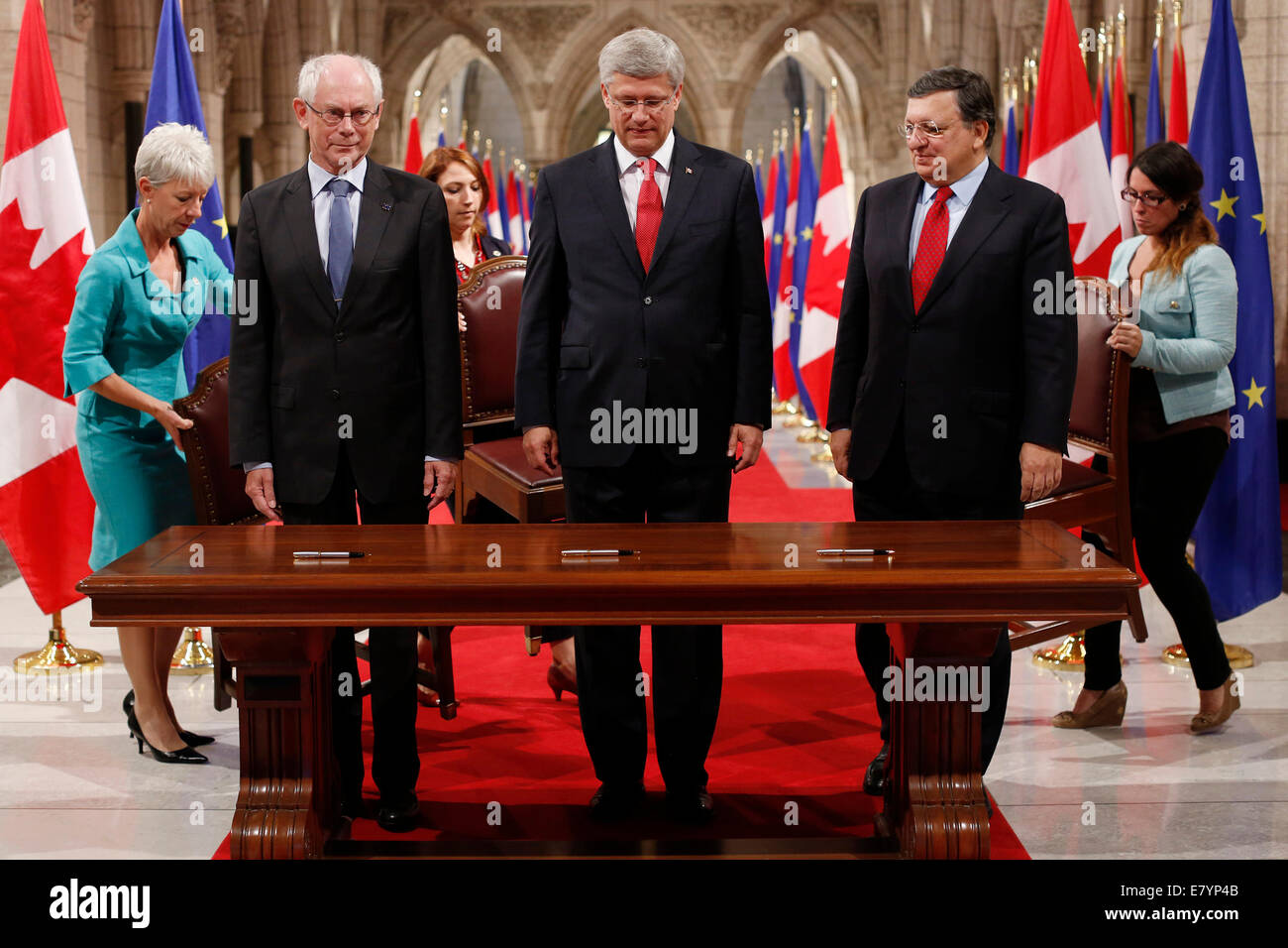 Ottawa. 26th Sep, 2014. Canada's Prime Minister Stephen Harper(C) stands with Herman Van Rompuy (L), President of the European Council, and Jose Manuel Barroso, President of the European Commission before the signing ceremony at Parliament Hill in Ottawa, Canada on Sept. 26, 2014. The European Union leaders were in town to officially sign on the Canada-EU Comprehensive Economic and Trade Agreement(CETA), for which negotiations ended in August, and which still needs to be approved by the European Council and the EU parliament. Credit:  David Kawai/Xinhua/Alamy Live News Stock Photo