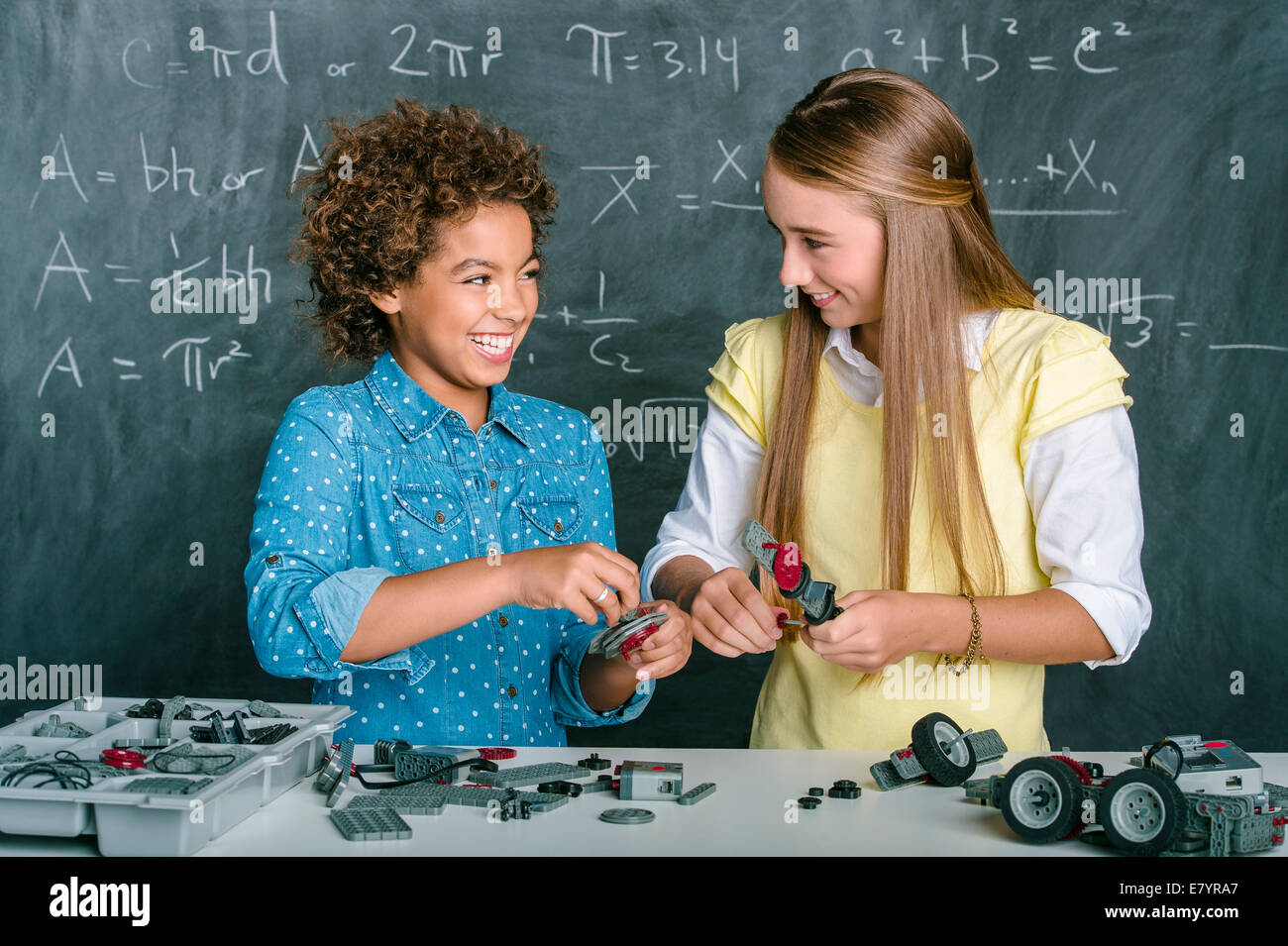 Two girls in classroom Stock Photo - Alamy