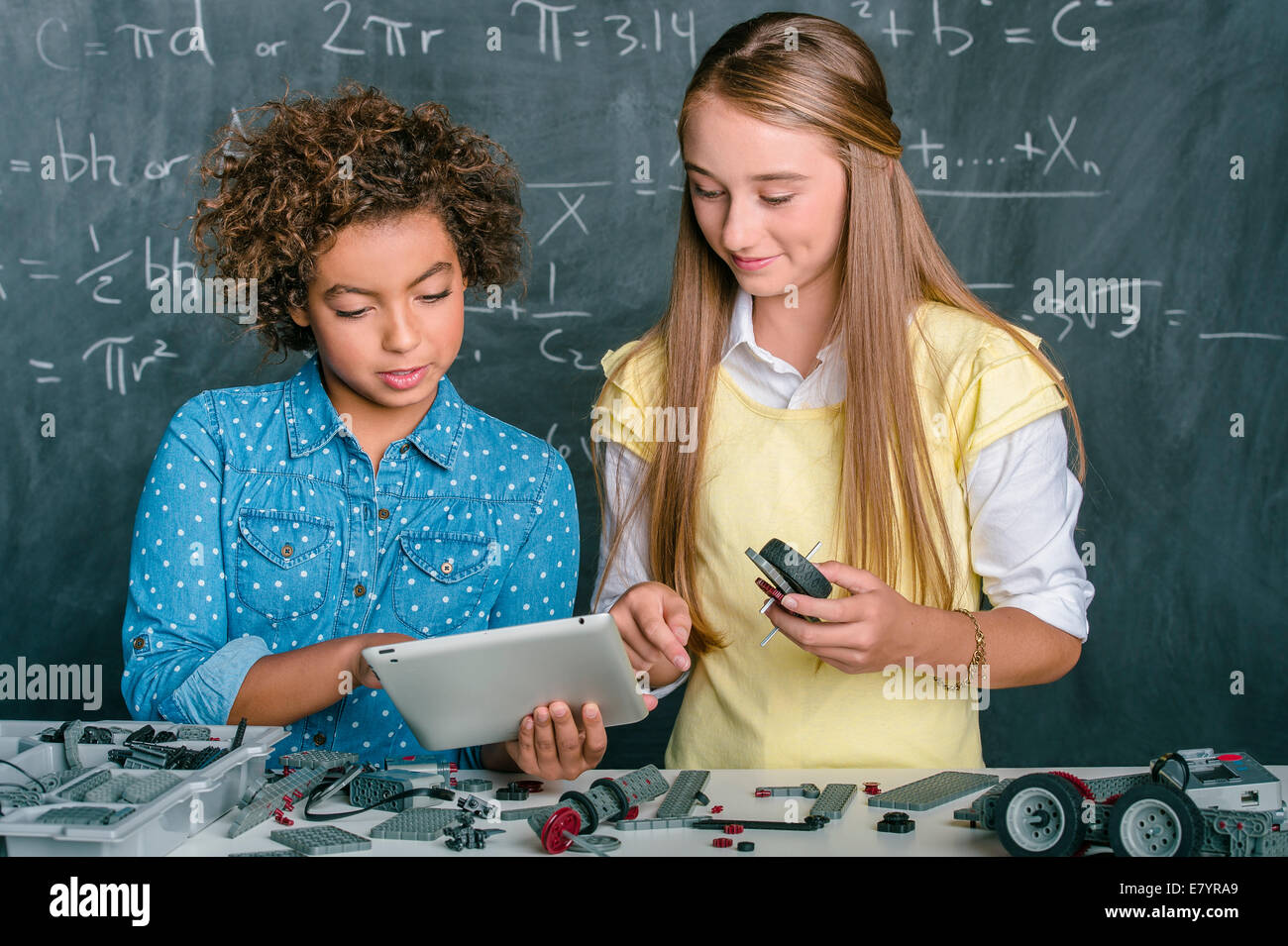 Two girls in classroom Stock Photo - Alamy
