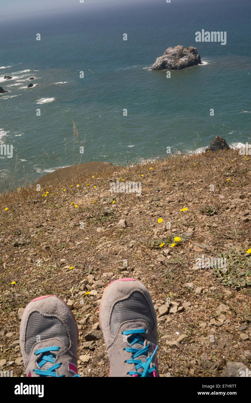 View of person resting at seaside Stock Photo