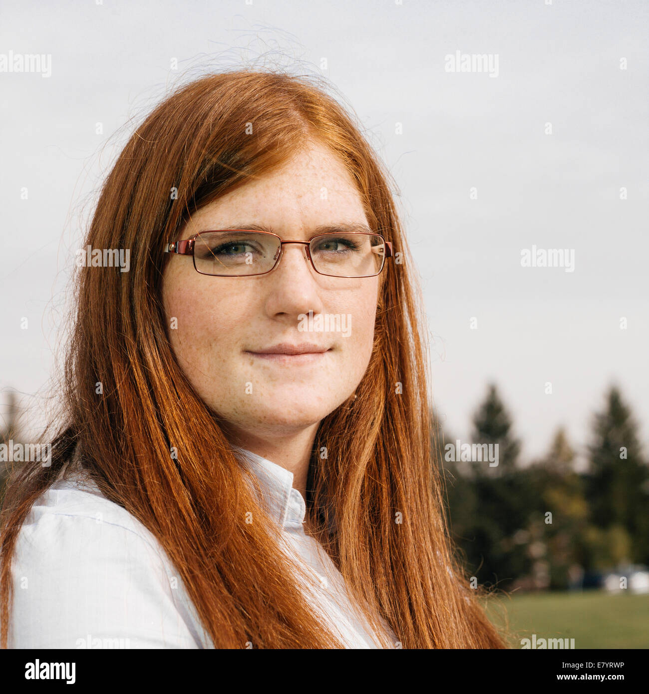Portrait of young woman with ginger hair Stock Photo - Alamy