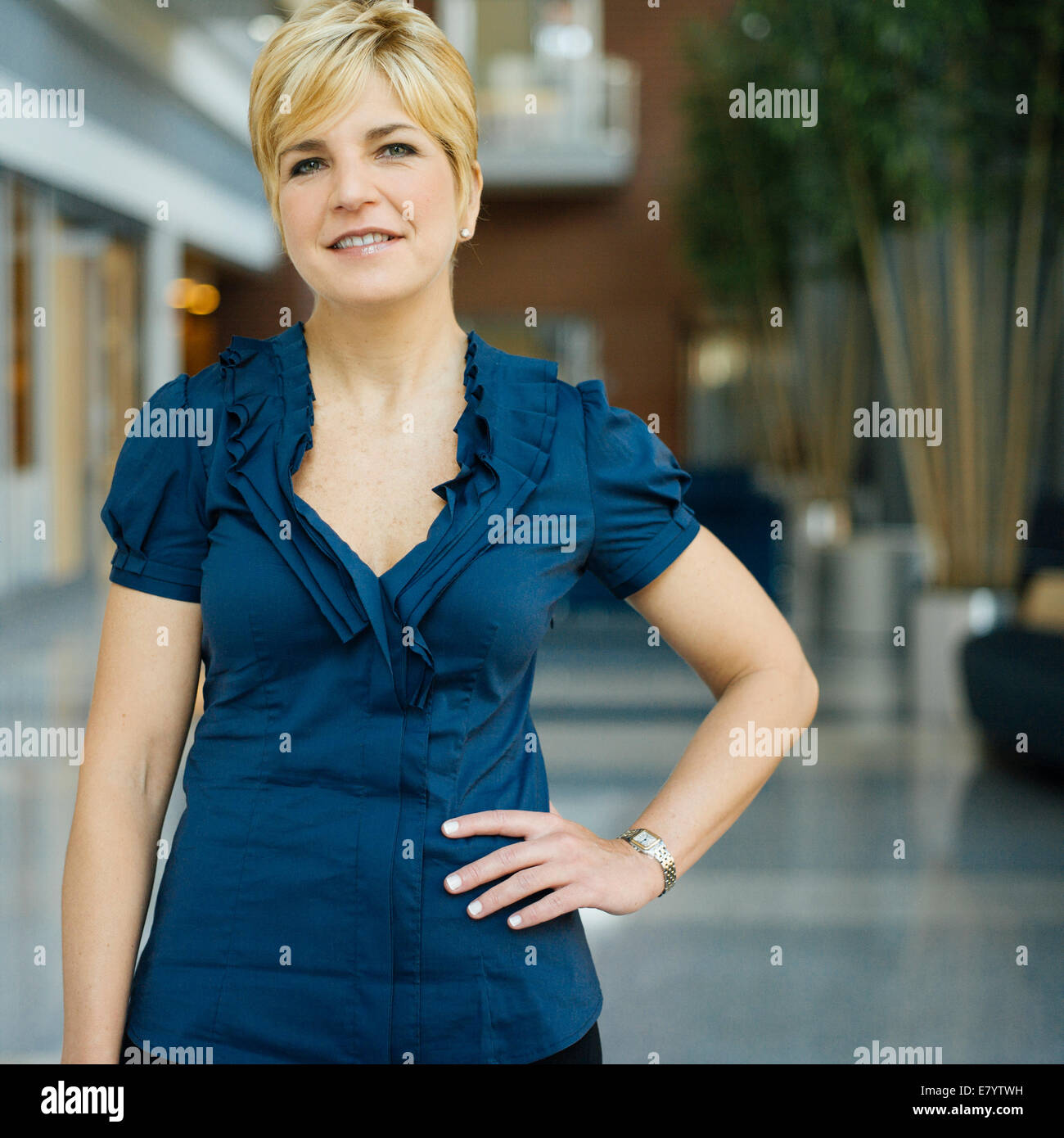 Portrait of woman in hallway Stock Photo