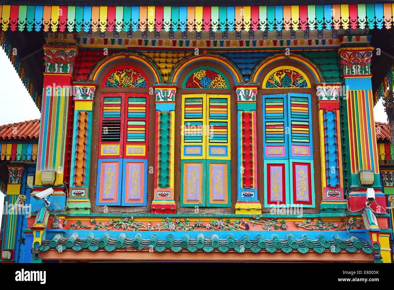 Traditional rainbow coloured house with colourful windows and shutters in Little India in Singapore, Republic of Singapore Stock Photo