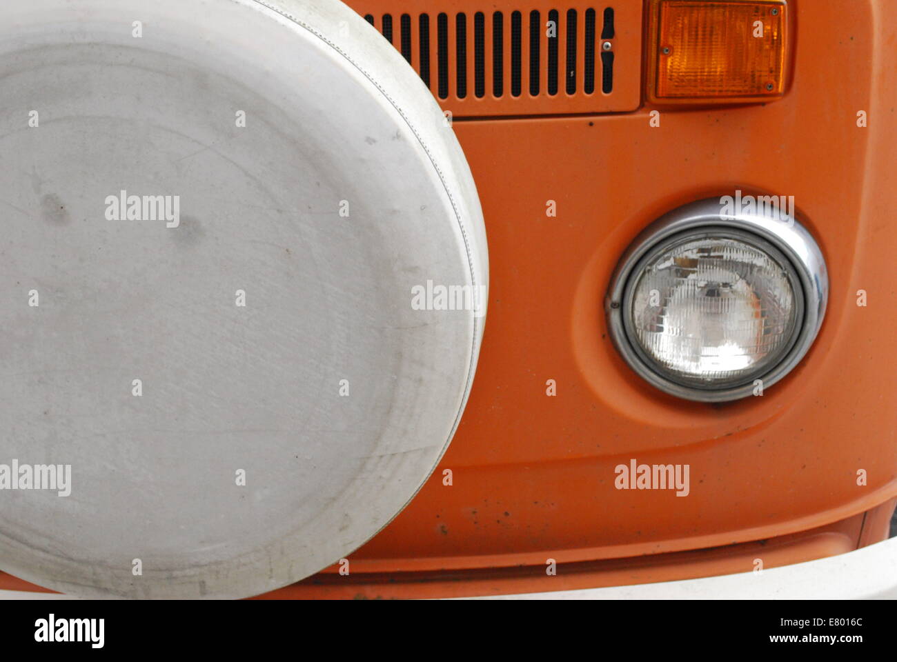 A cropped photo of a Orange Volkswagen Bus Stock Photo