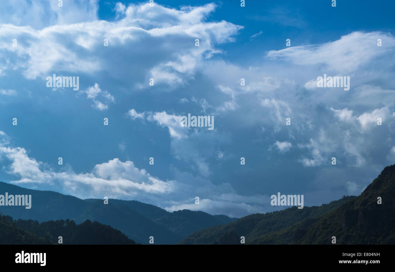 Cloudy mountain landscape Stock Photo - Alamy
