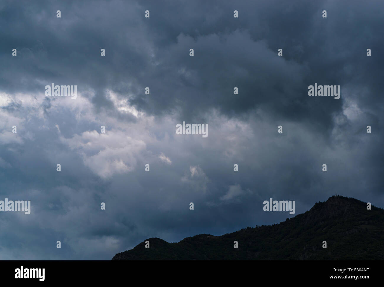 Cloudy mountain landscape Stock Photo - Alamy