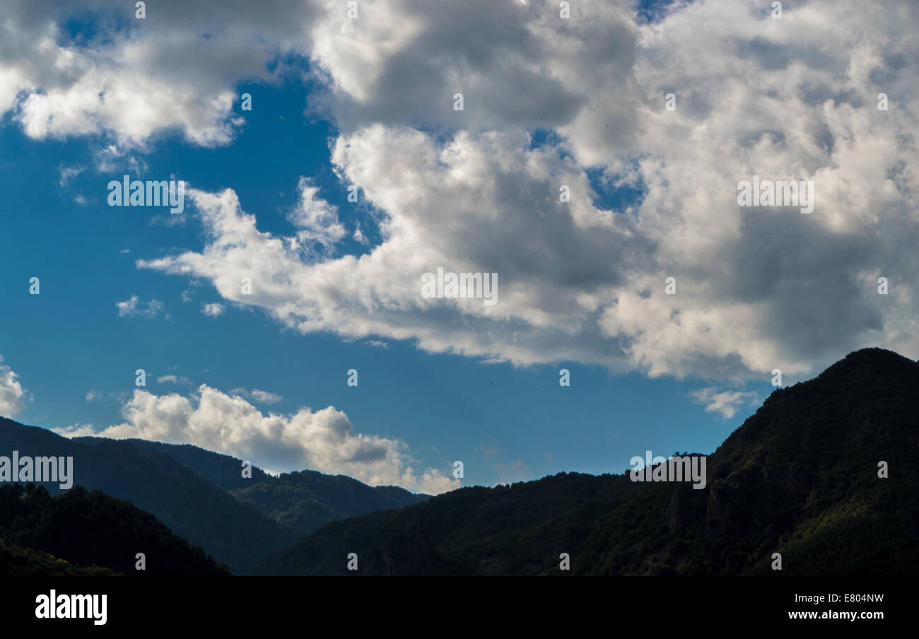 Cloudy mountain landscape Stock Photo - Alamy