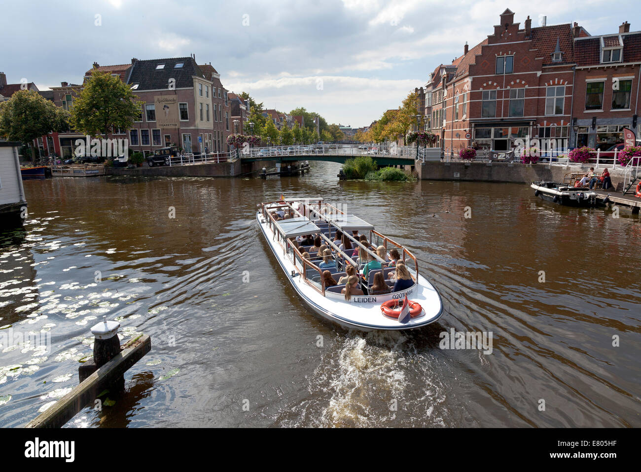 Canal boat in canal on Herengracht, Leiden, Netherlands Stock Photo