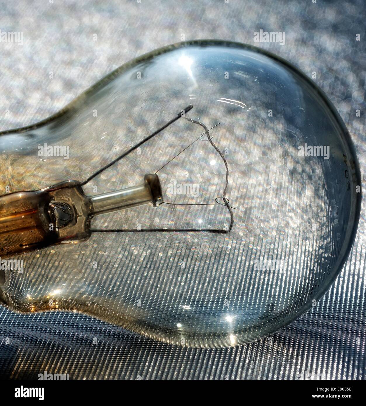 Close up shot of a light bulb with a broken filament Stock Photo