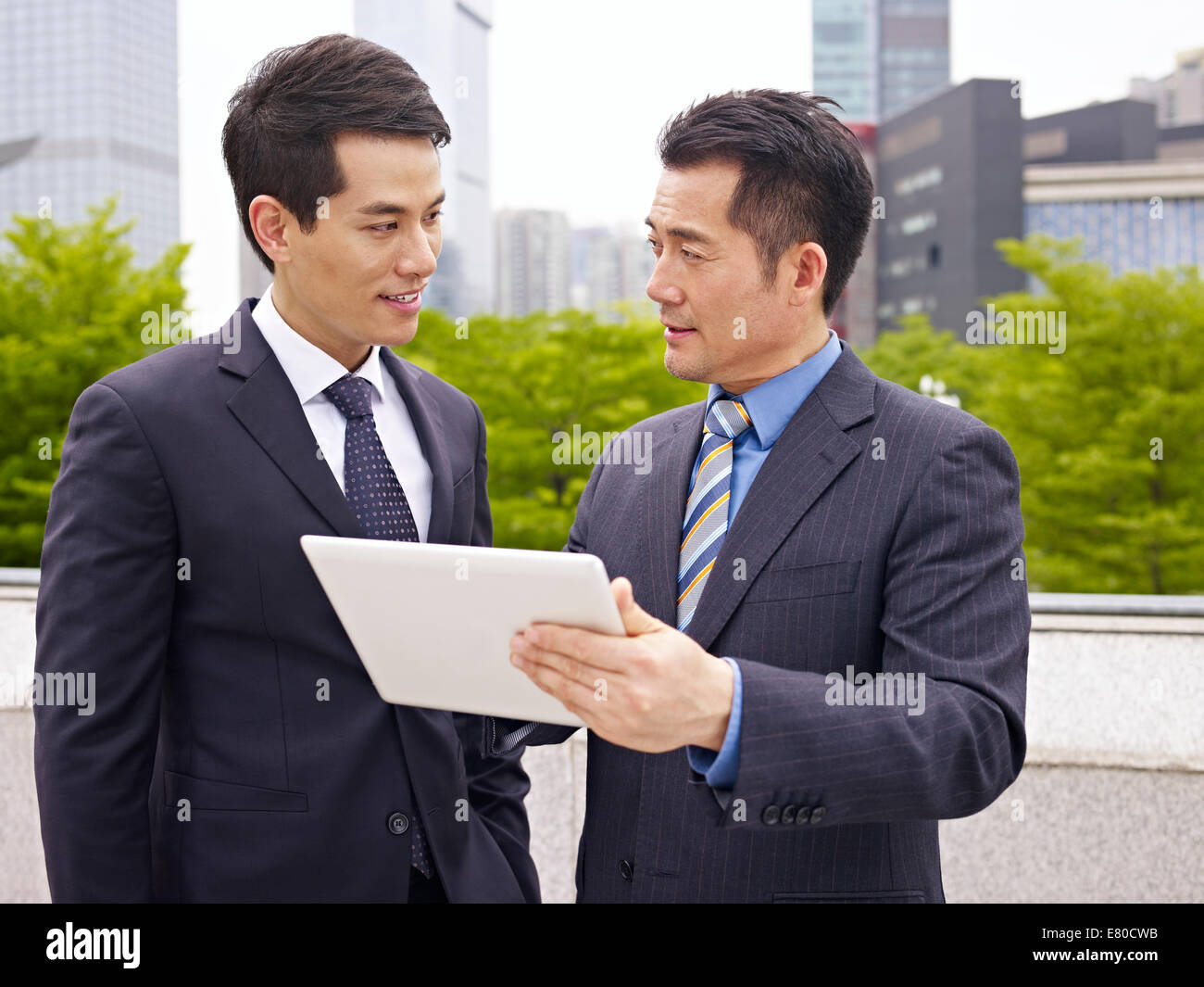 asian businessperson talking outdoor Stock Photo