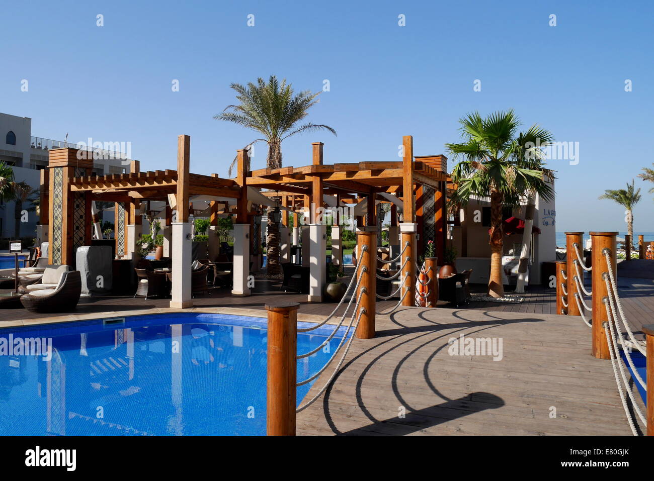 Pool bar and swimming pool at the beach resort of the Hotel Sofitel, Zallaq, Kingdom of Bahrain Stock Photo