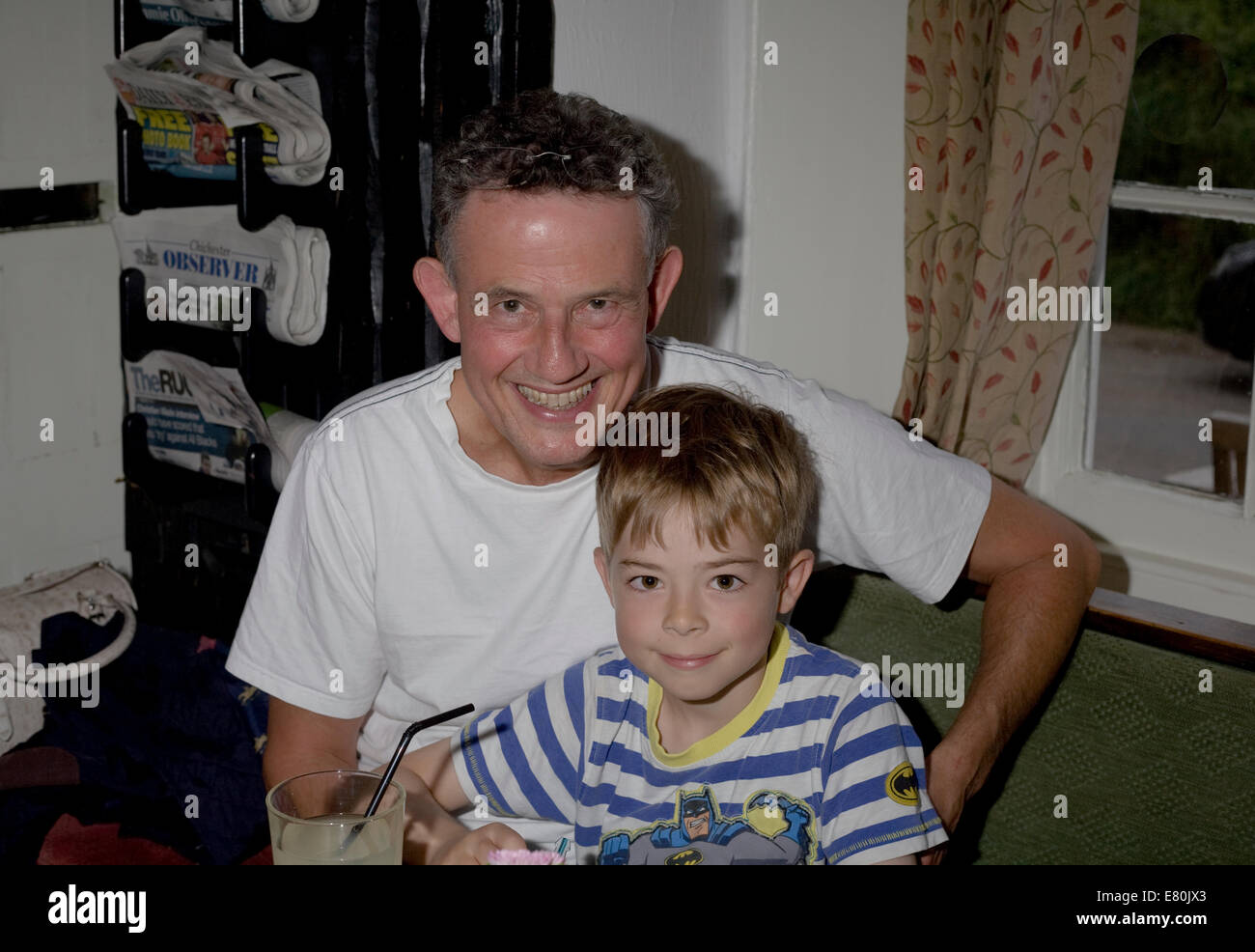 father and son at old house at home pub in Chidham west sussex Stock