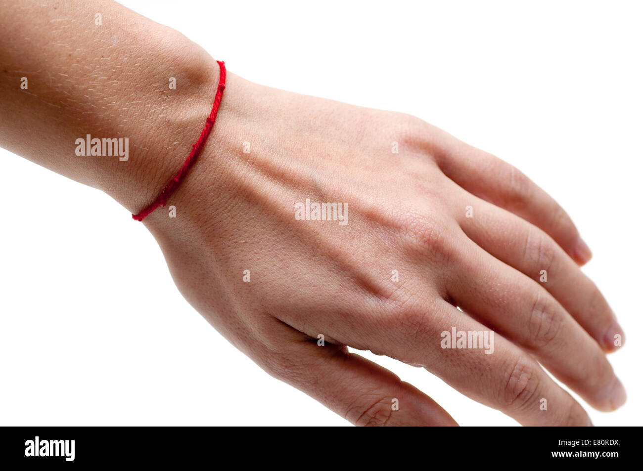 Red string bracelet on a woman's' left hand, to ward off misfortune. Stock Photo