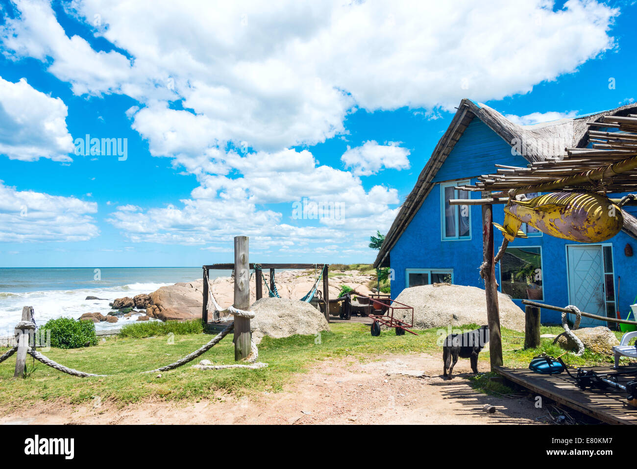 Typical brightly colored houses on the picturesque beach in Punta del Diablo, popular tourist place in Uruguay Stock Photo