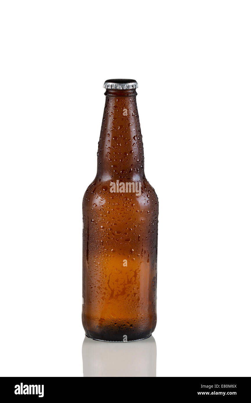 Closeup vertical image of a single unopened cold brown beer bottle covered with dew on white with reflection Stock Photo