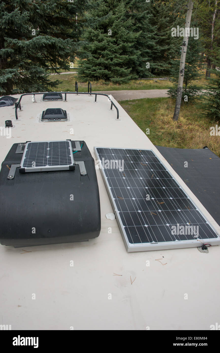 Solar panels on the top of a travel trailer.  The panels are used to charge the trailer batteries. Stock Photo