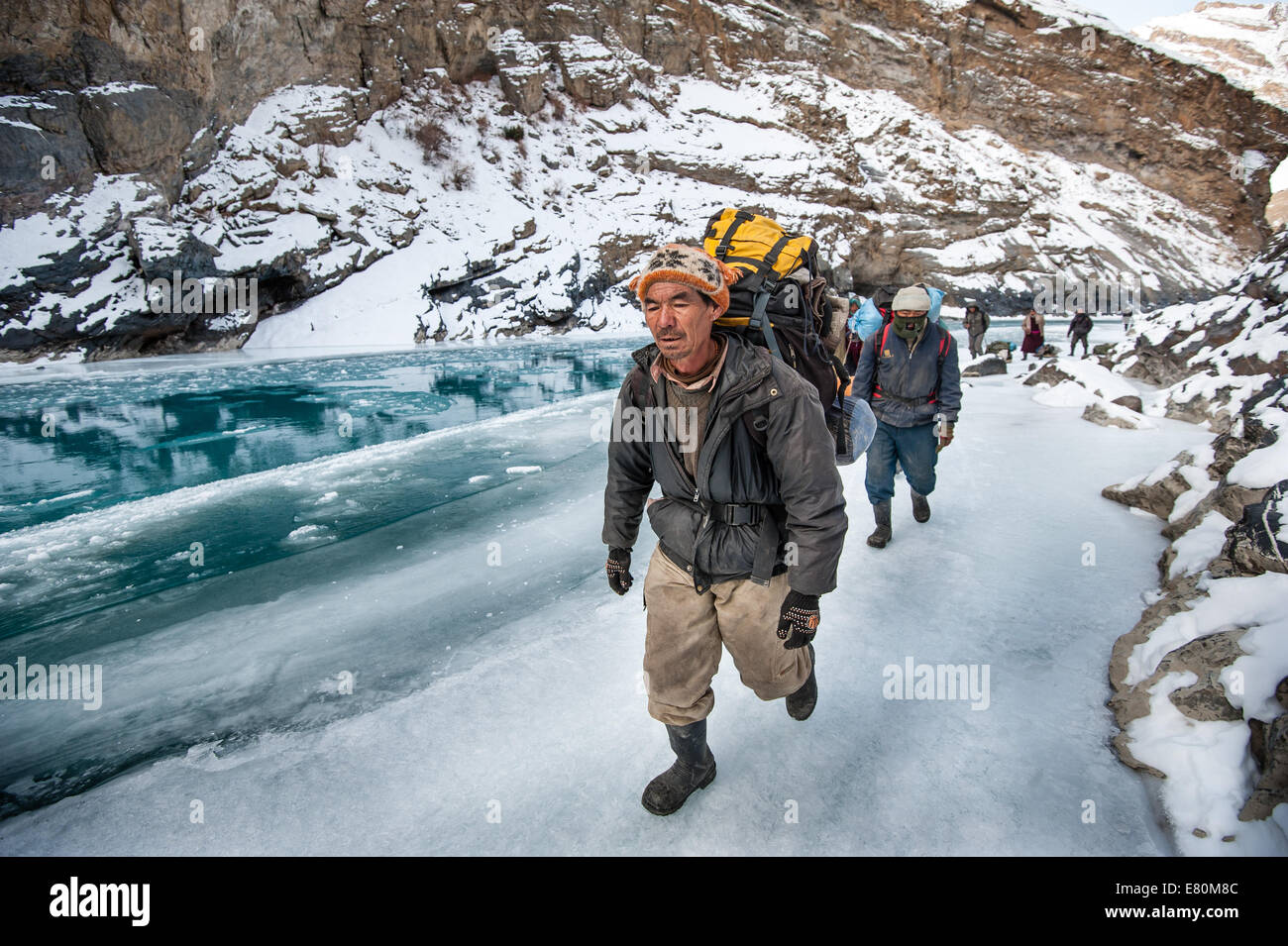 Porters are pulling trekkers luggage on Zanskar River during Chadar trek Stock Photo