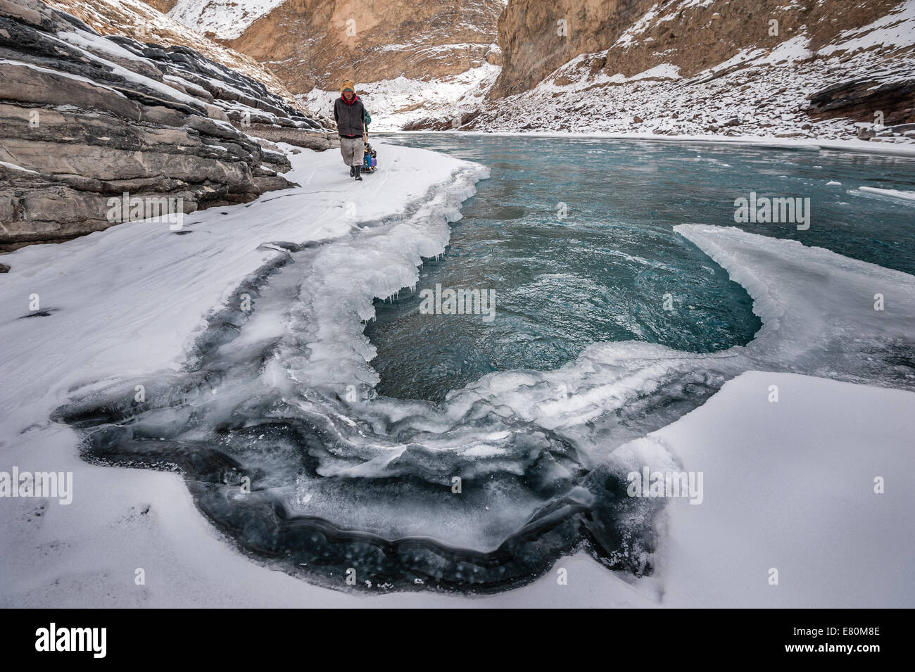 Porters is pulling trekkers luggage on Zanskar River during Chadar trek Stock Photo