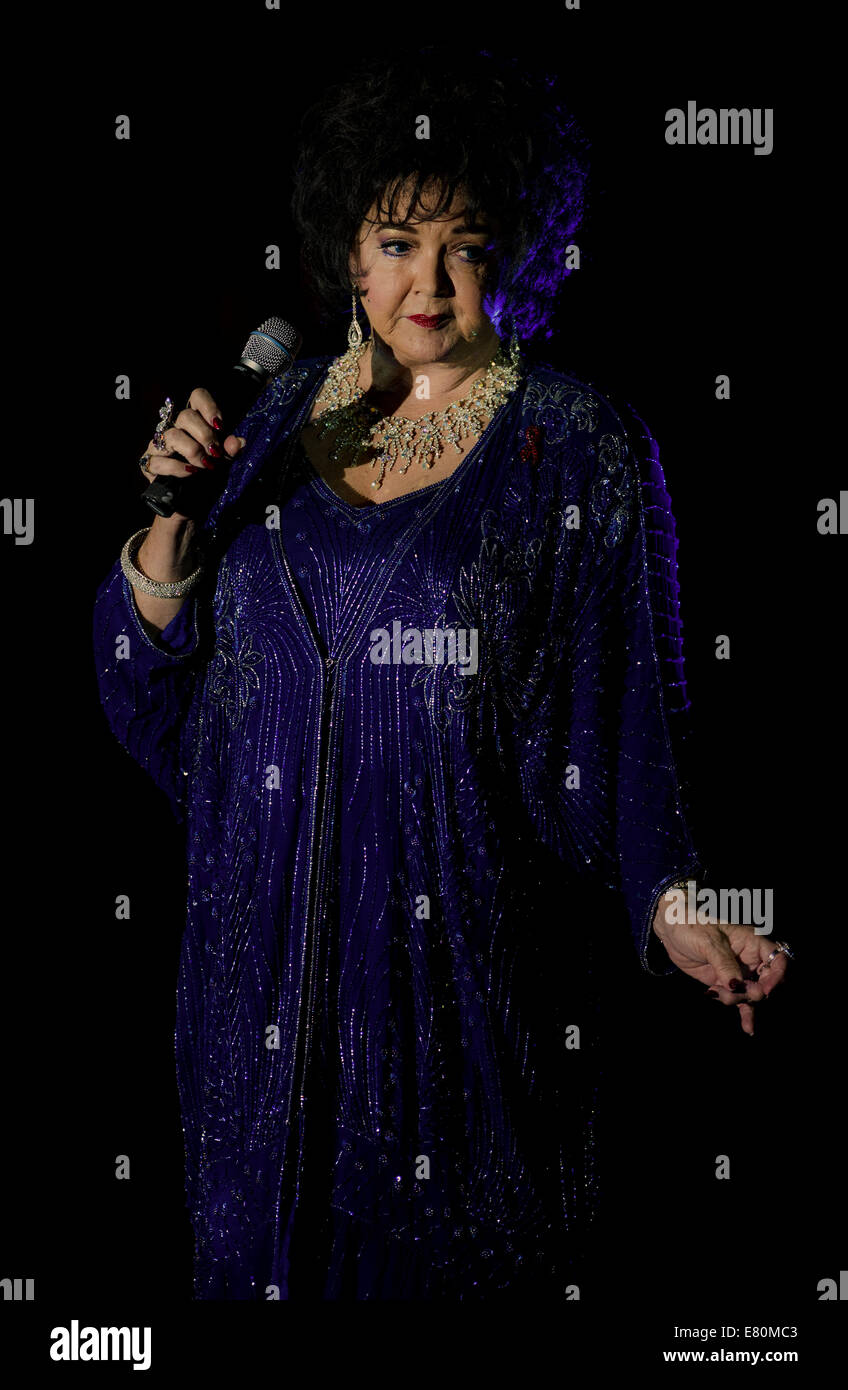 Orlando, Florida, USA. 27th Sep, 2014. LOUISE GALLAGHER performs as Dame Elizabeth Taylor during a showcase at the 12th Annual Sunburst Convention of Celebrity Impersonators and Tribute Artists. Dozens of celebrity impersonators and look-alikes gather here each year to perform in front of agents, talent buyers and producers to try to get work in this entertainment industry niche. Credit:  Brian Cahn/ZUMA Wire/Alamy Live News Stock Photo