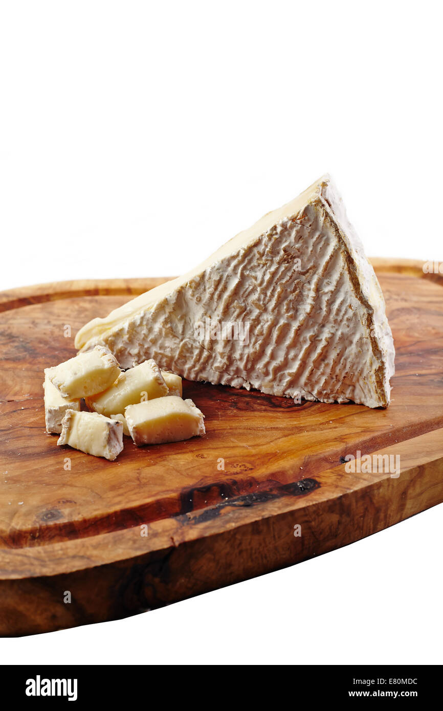 Cheese on a wooden board with white background Stock Photo