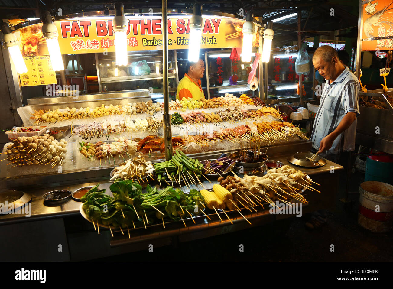 Satay stall with street food in Jalan Alor in Bukit Bintang in Kuala Lumpur, Malaysia Stock Photo