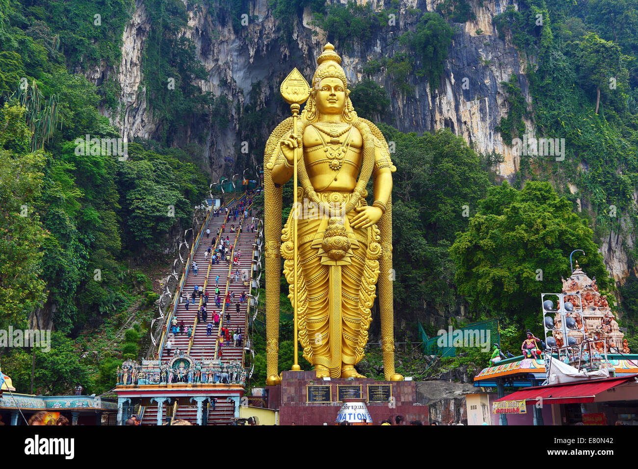 Giant golden statue of the god Murugan at the entrance of the Batu Caves, a Hindu shrine in Kuala Lumpur, Malaysia Stock Photo